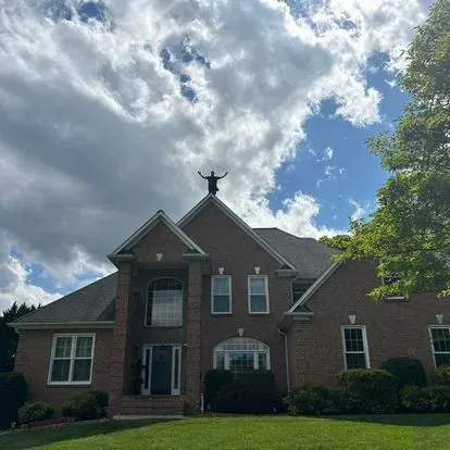 New roof installation on brick home by Iconic Roofing
